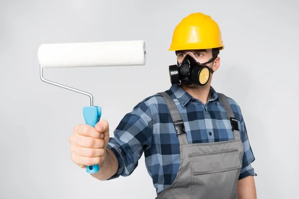 Construction worker with paint roller — Stock Photo, Image