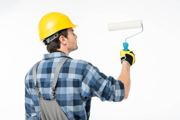 Workman with paint roller  
