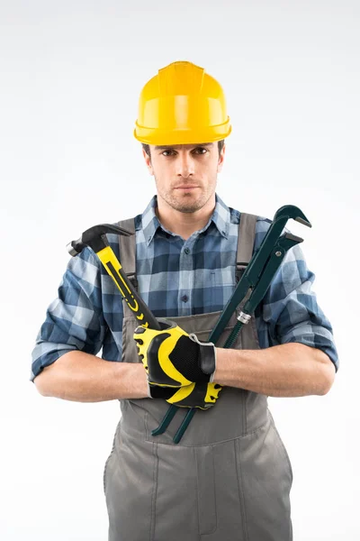 Workman holding hammare och rörtång — Stockfoto