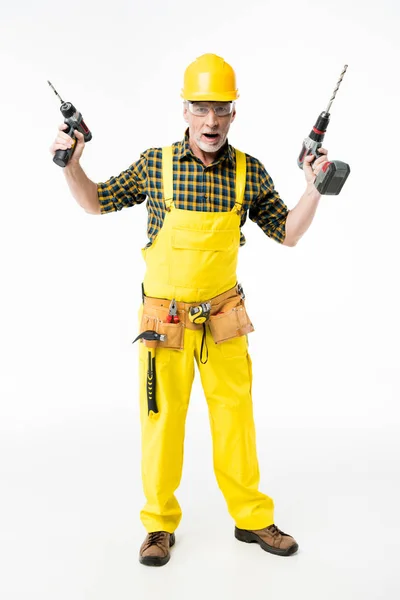 Obrero sosteniendo taladros eléctricos — Foto de stock gratis