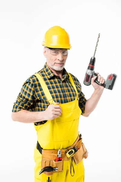 Obrero sosteniendo taladro eléctrico — Foto de Stock