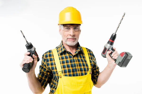 Workman holding electric drills — Stock Photo, Image