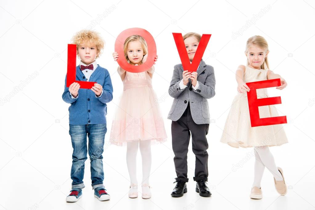 Kids holding word love 