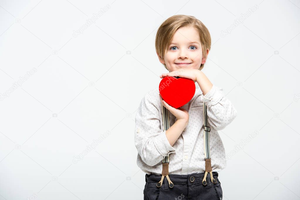 Boy with heart sign