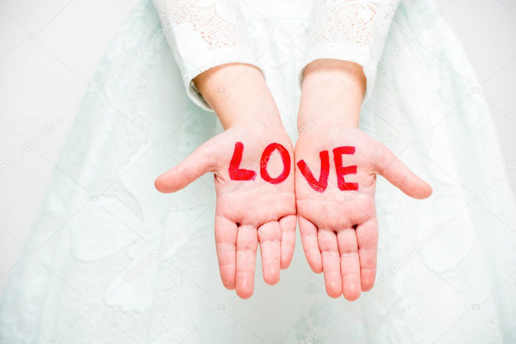 Word love written on palms