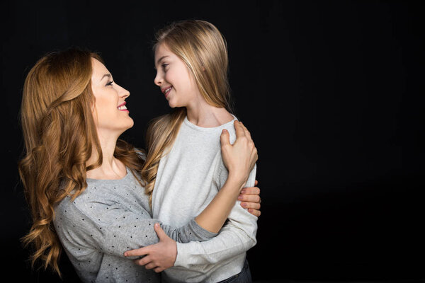 Mother and daughter hugging