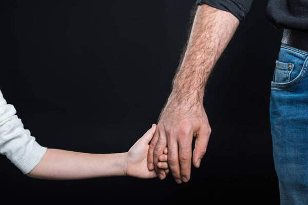 Hands of man and child