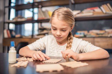 Little girl handcrafting clipart