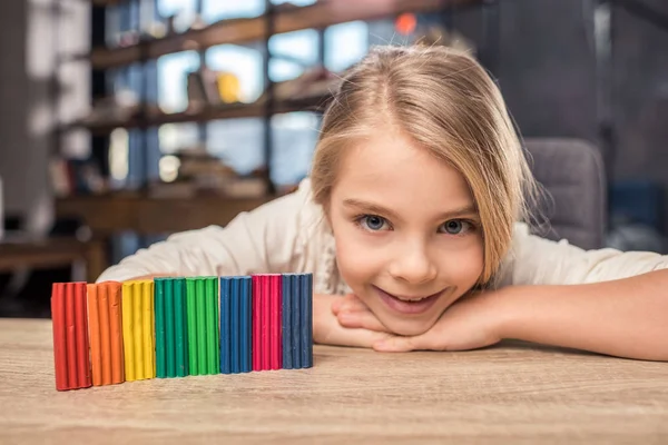 Girl playing with plasticine — Stock Photo, Image