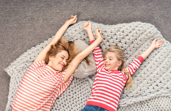 Mother and daughter waking up