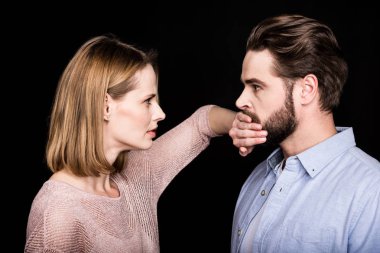 Woman covers mouth of man clipart