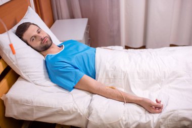 Male patient in hospital clipart