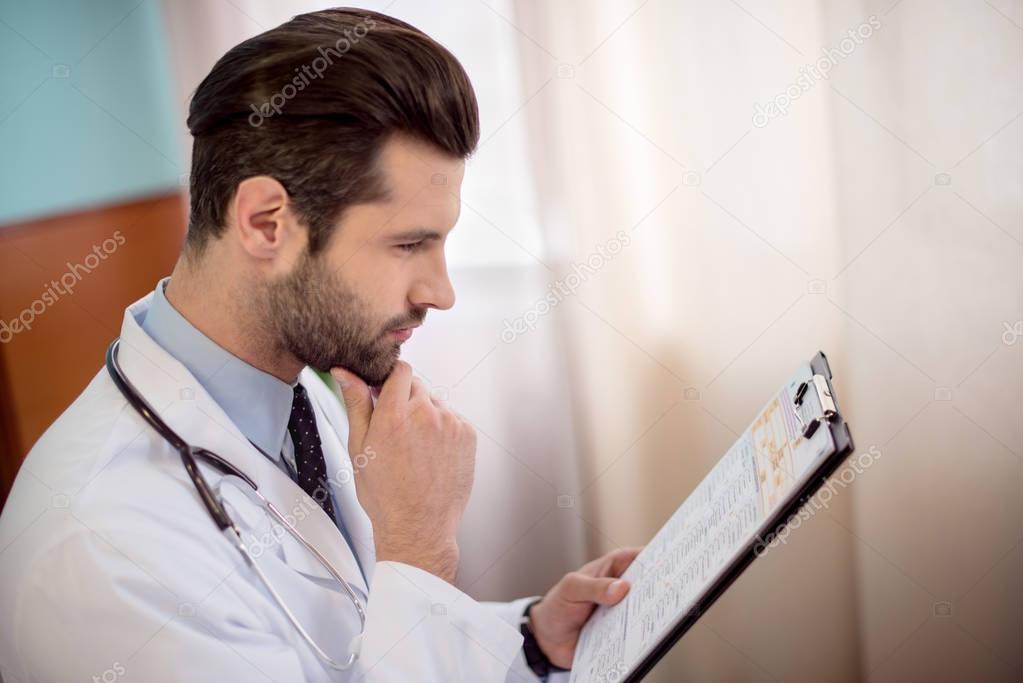 Doctor holding folder 