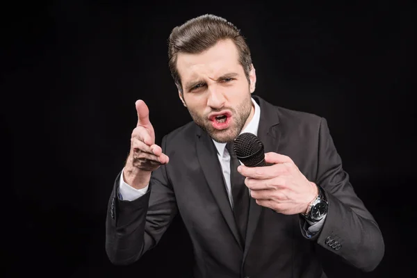 Young man with microphone — Stock Photo, Image