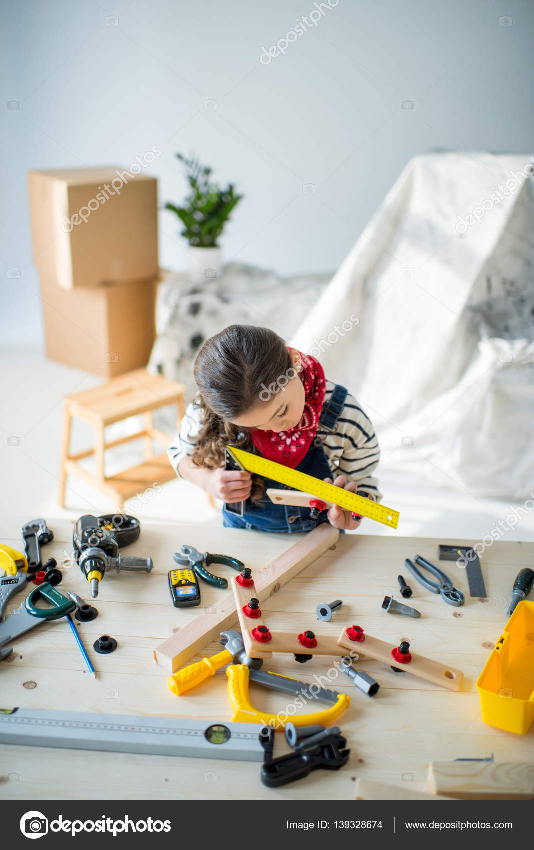 Little girl with tools — Stock Photo © IgorTishenko #139328674