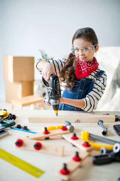 Little girl with tools