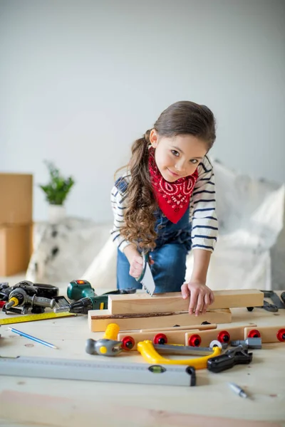 Little girl with tools — Stock Photo, Image
