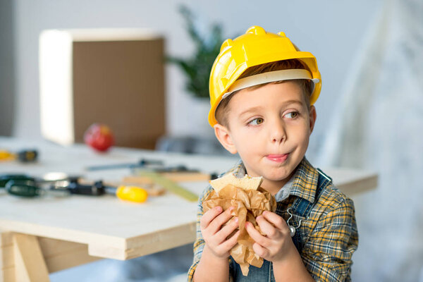 Boy eating sandwich 