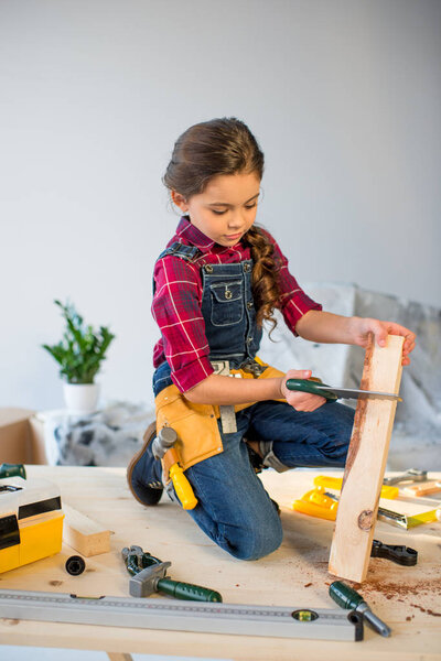 Little girl in workshop