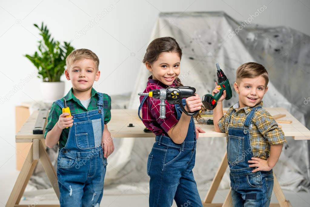 Happy kids with tools