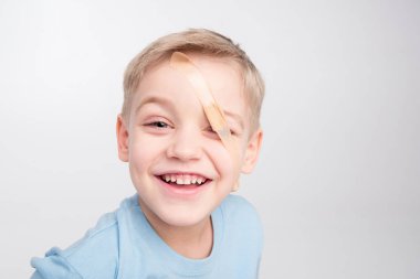 Little boy with patch on eye clipart