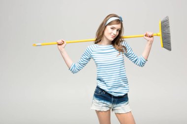 Young woman with broom clipart