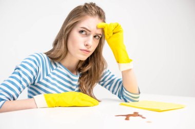 Unhappy woman in rubber gloves clipart