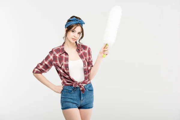 Young woman with duster — Stock Photo, Image