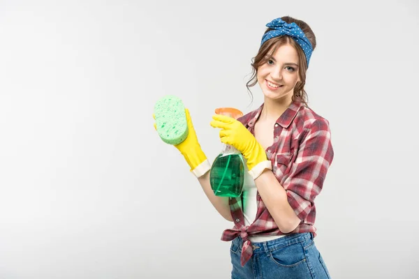 Woman with sponge and spray bottle — Stock Photo, Image