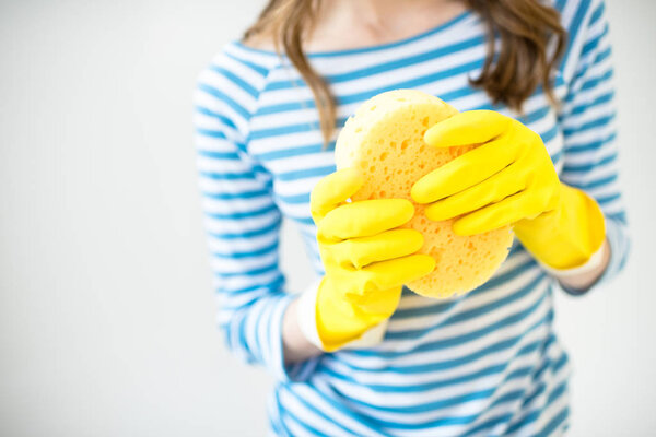 Woman holding sponge