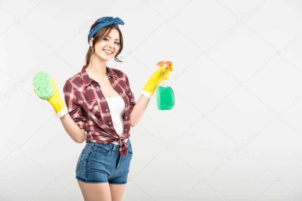 Woman with sponge and spray bottle