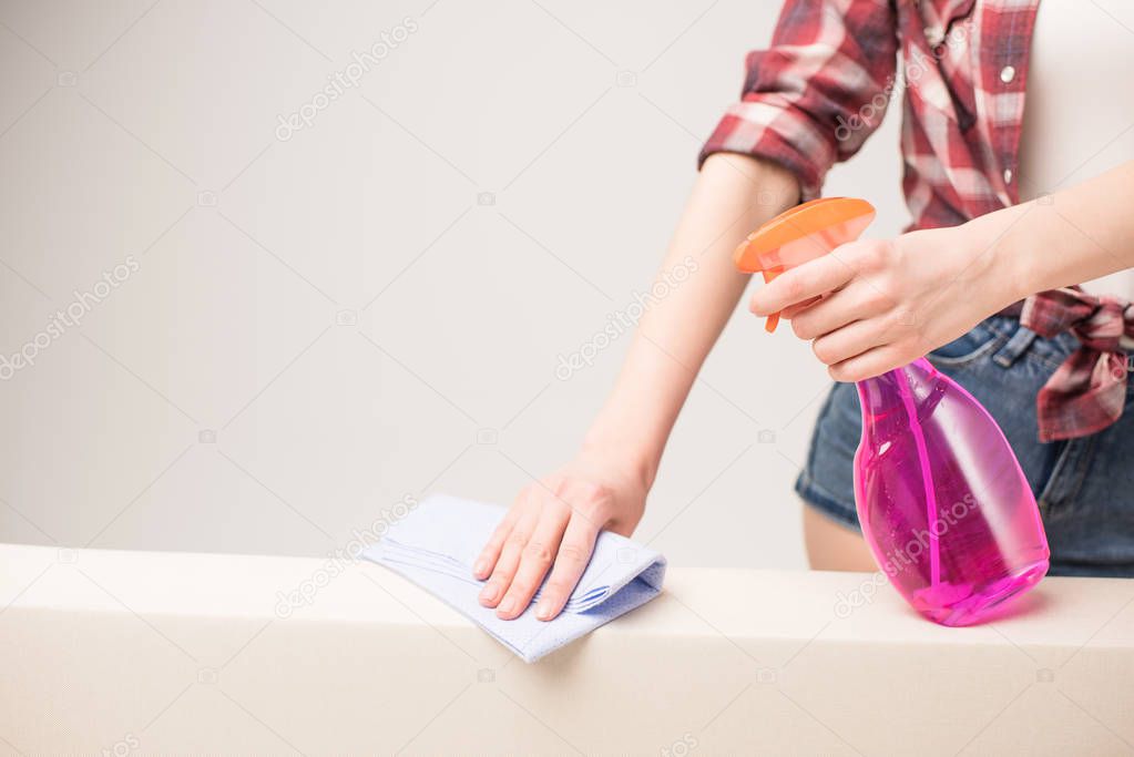 Woman cleaning surface 