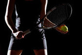 Woman with tennis racket and ball