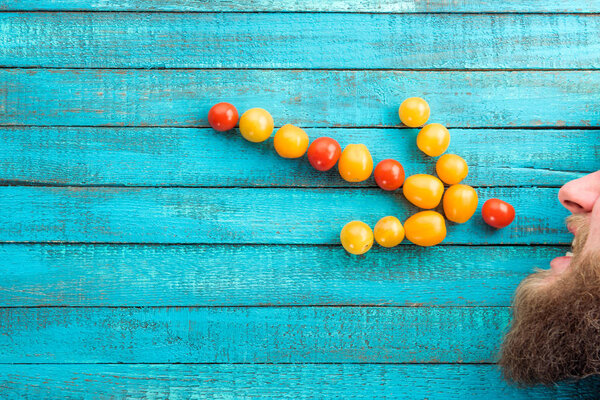 arrow made of cherry-tomatoes