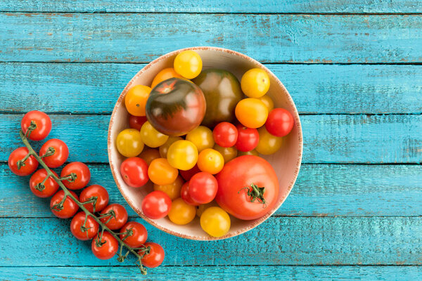 tomatoes in bowl on table