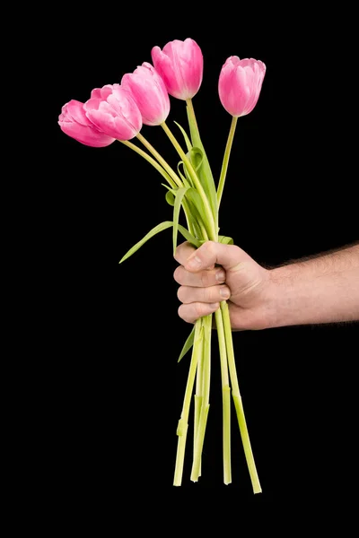 Homem segurando tulipas — Fotografia de Stock