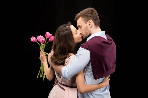 Couple in love with tulips — Stock Photo, Image