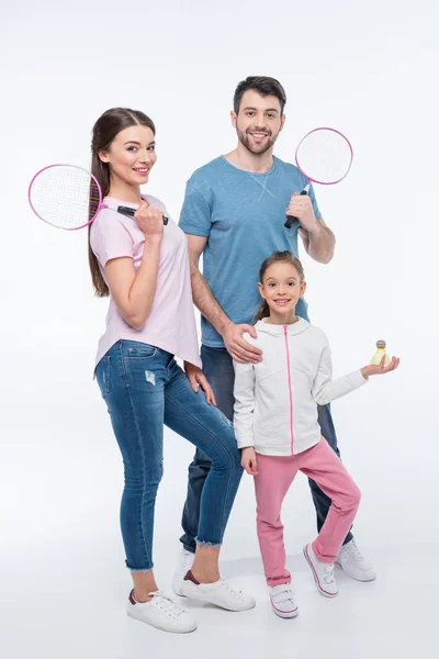 Young family with badminton rackets — Stock Photo, Image