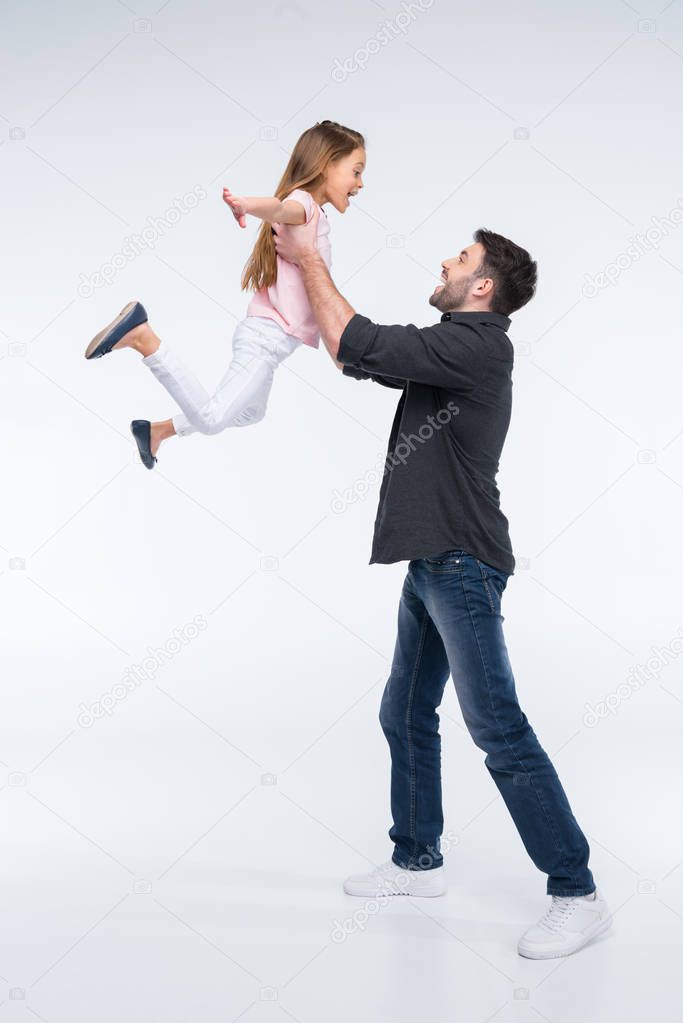 father playing with daughter