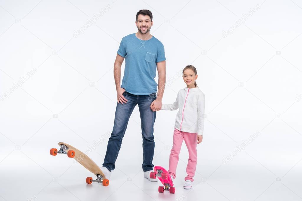 father and daughter with skateboards