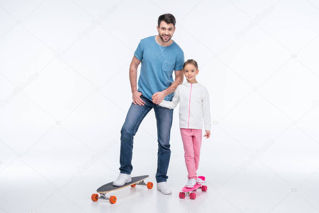 father and daughter with skateboards