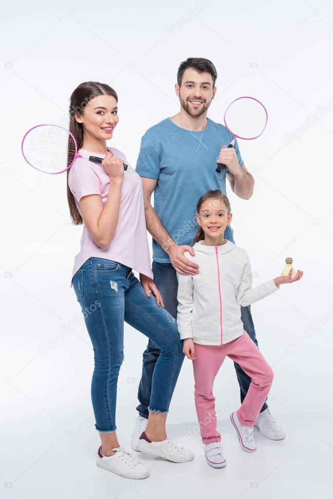 young family with badminton rackets  