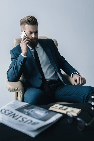 businessman talking on smartphone