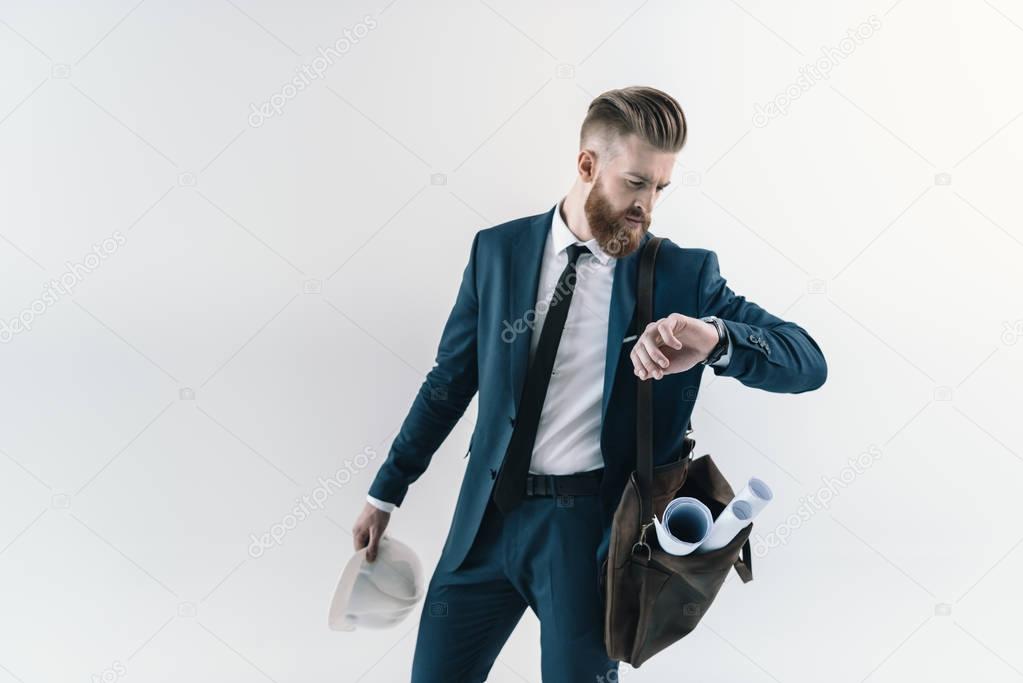 Businessman checking wristwatch