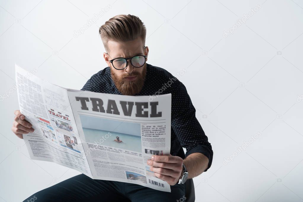 stylish man reading newspaper