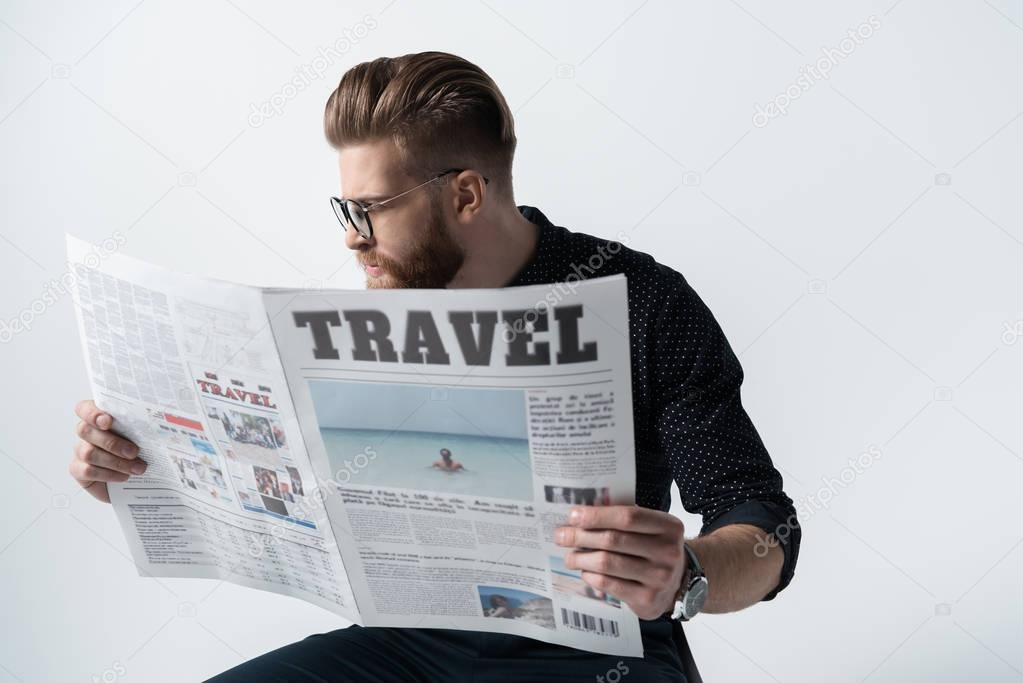 stylish man reading newspaper