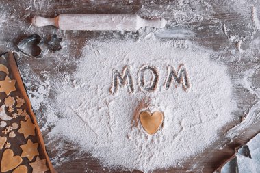 Word mom in flour  clipart