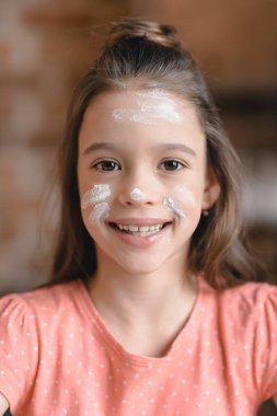 Girl with flour on face clipart