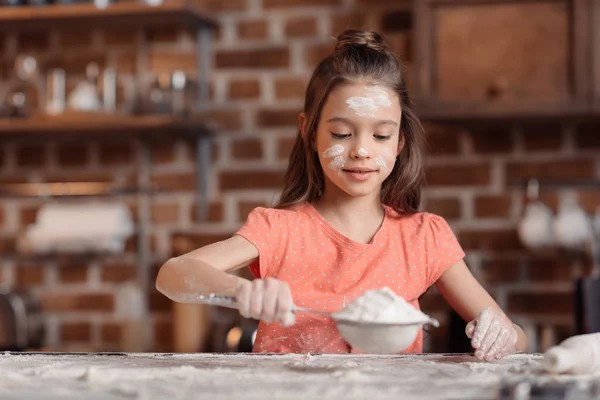 Girl with flour on face — Stock Photo, Image