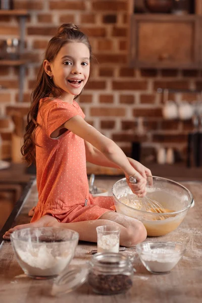 little girl baking pastry